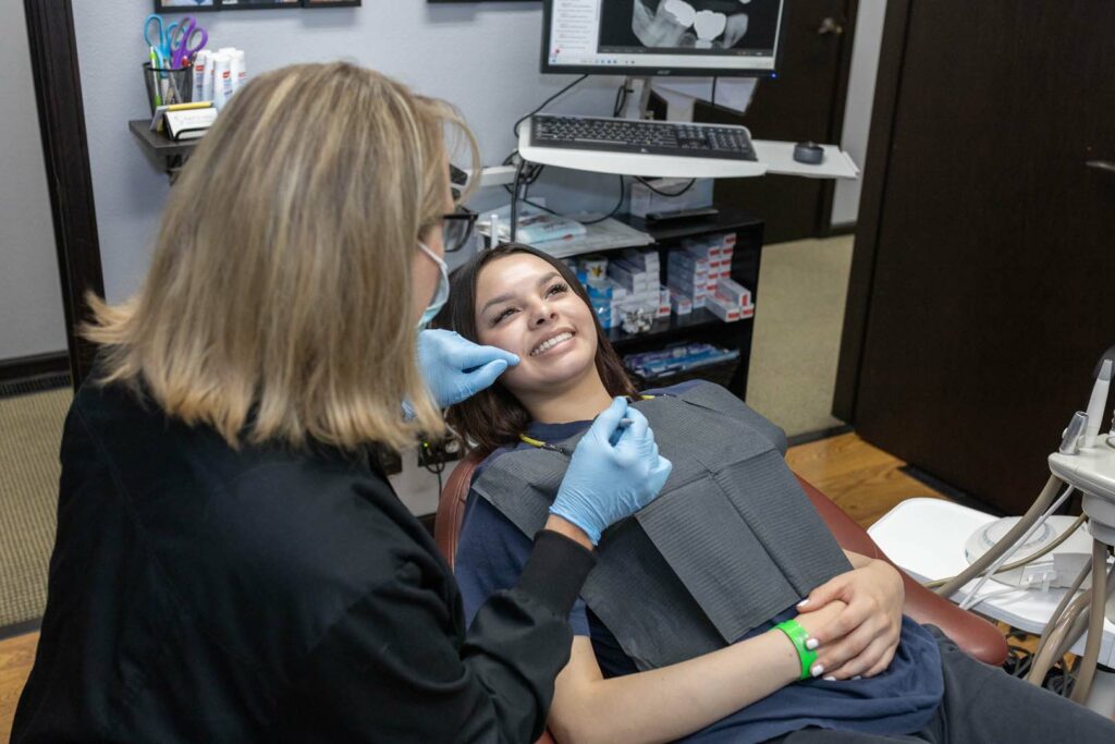 Happy patient receiving dental checkup at Rapid City implant and family dentistry clinic