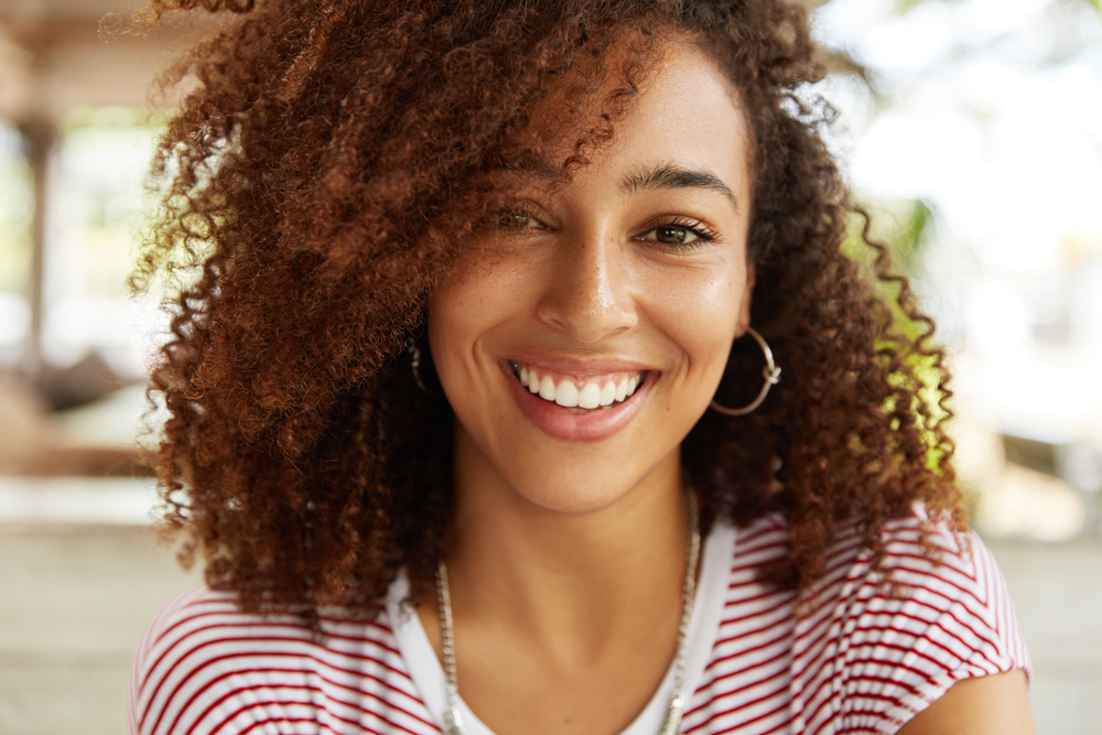 Smiling woman showing healthy teeth in Rapid City SD dental care