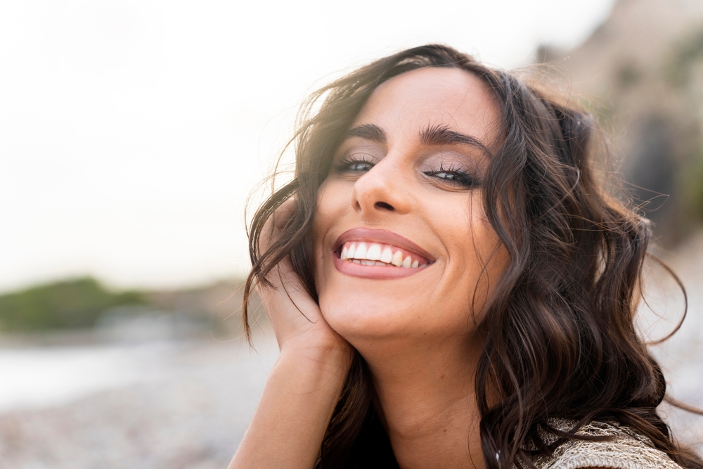 Woman with bright white smile after Cerec Same-Day Crowns in Rapid City