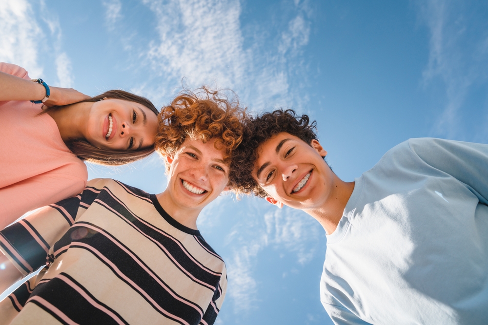 friends smiling brightly after Full and partial dentures to restore teeth in Rapid City SD