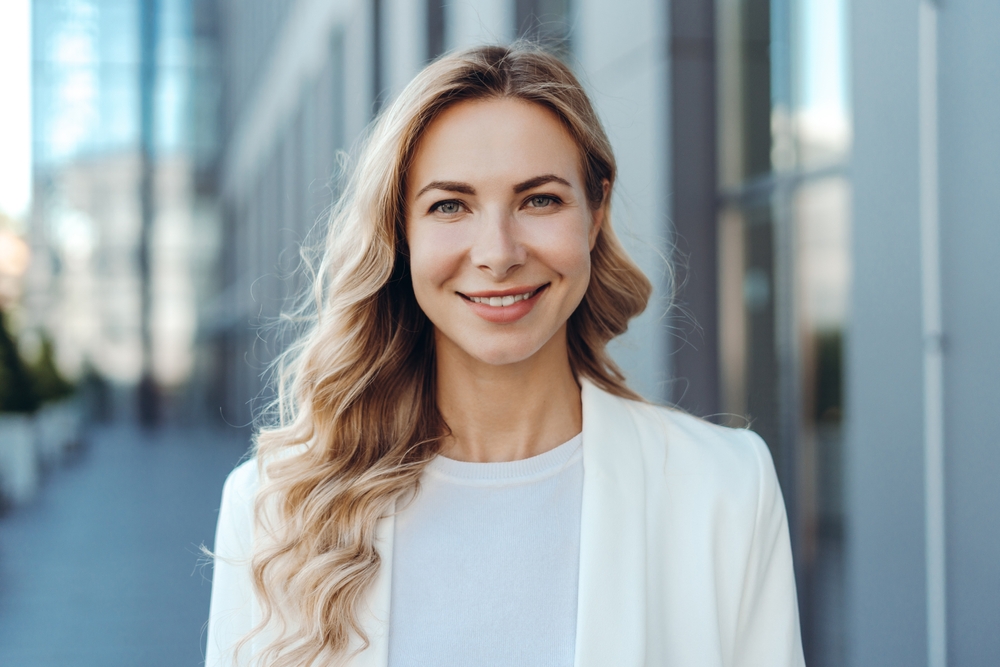 Smiling woman representing comfortable and stress-free denture treatmet